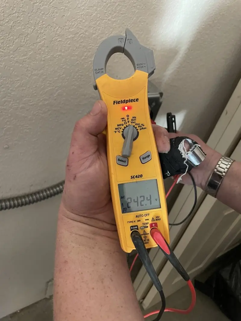 Voltage testing with clamp meter during Hot Tub / Pool Electrical Wiring in North Liberty